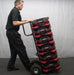 shows a man using a dolly to transport Phoenix AirMAX Radial Air Movers