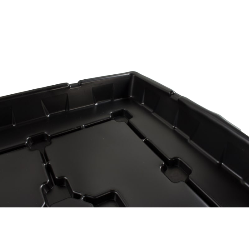 close up view of black dehumidifier drip tray on white background