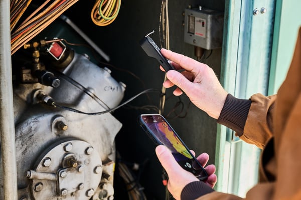 flir one edge pro being used to inspect compressor