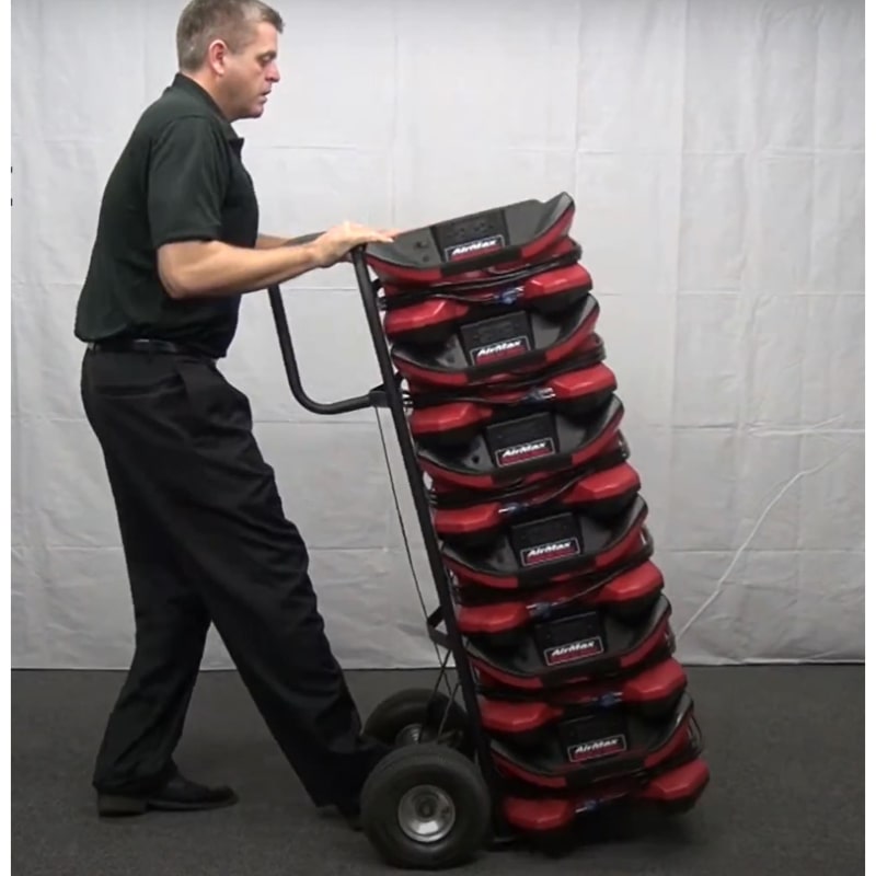 phoenix radial air movers in red stacked on a dolly being moved