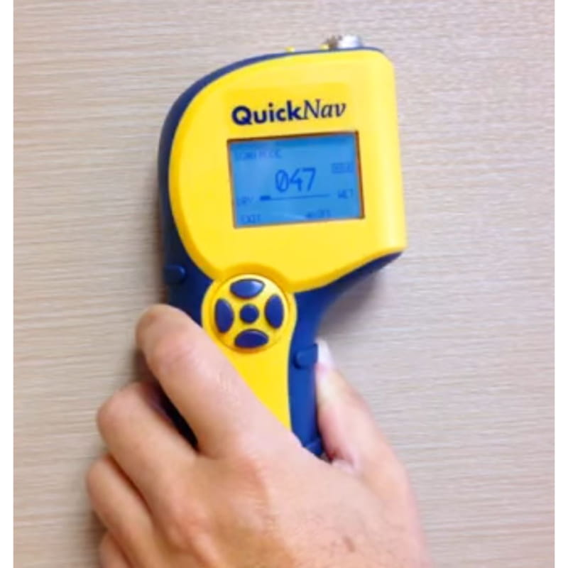 delmhorst quicknav being used by someone to scan for moisture