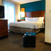 XPOWER X-2580 Professional 4-Stage HEPA Mini Air Scrubber in hotel room view