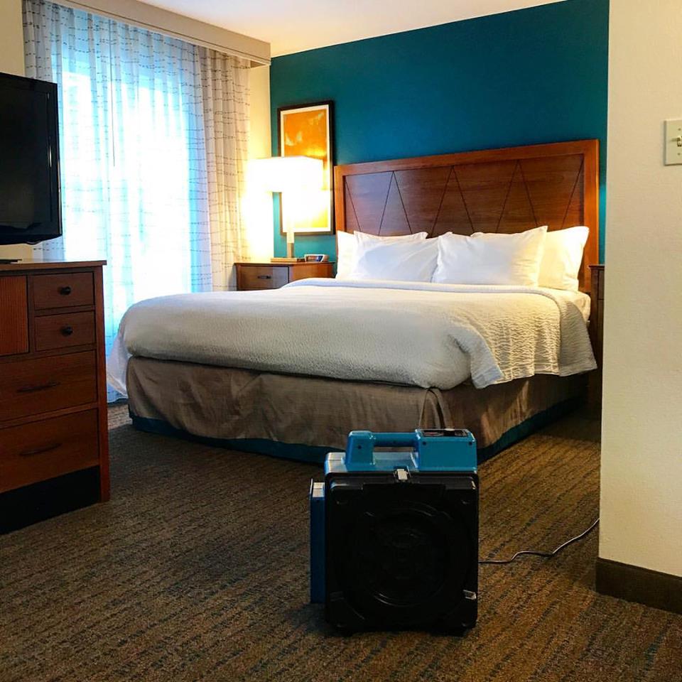 XPOWER X-2580 Professional 4-Stage HEPA Mini Air Scrubber in hotel room view