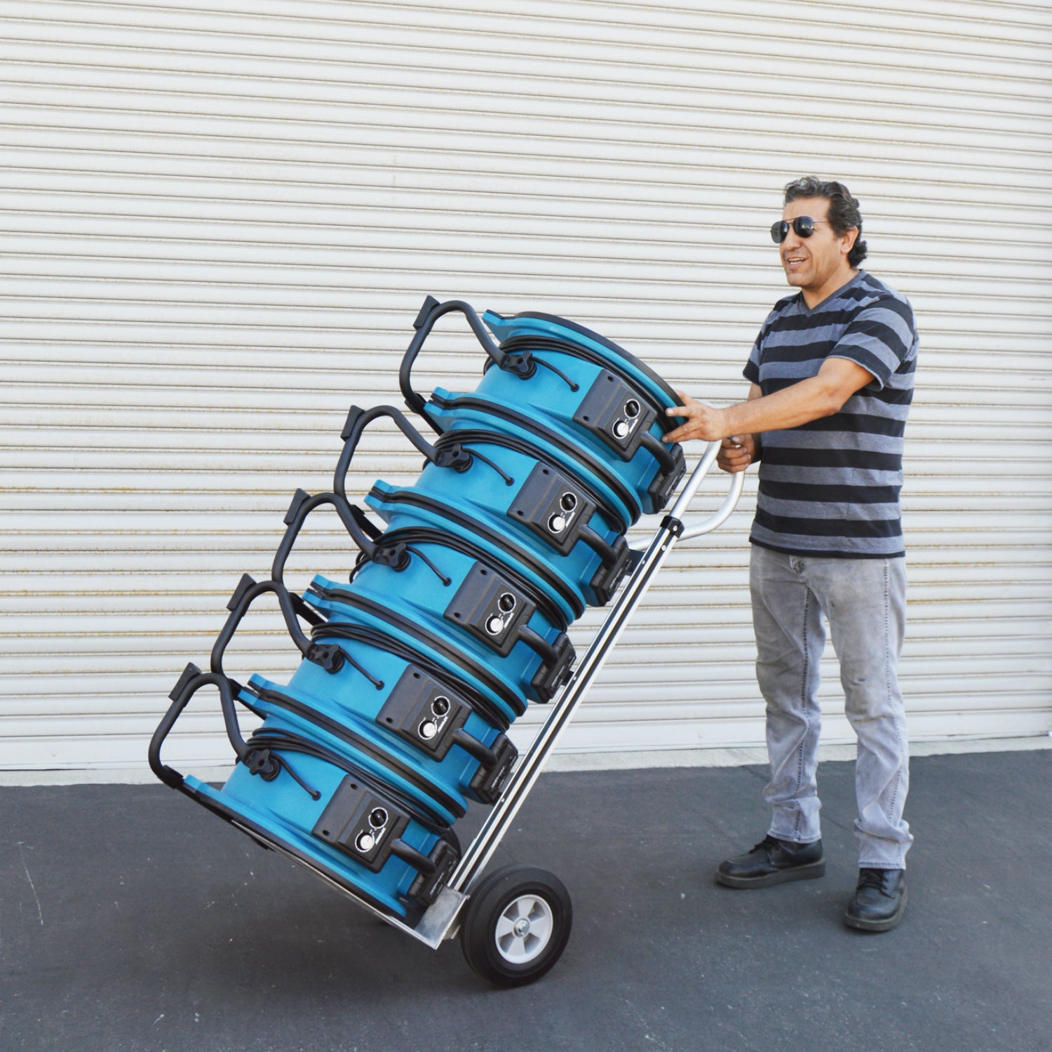 XPOWER X-47ATR Professional Sealed Motor Axial Fan (1/3 HP) man using dolly to transport fans