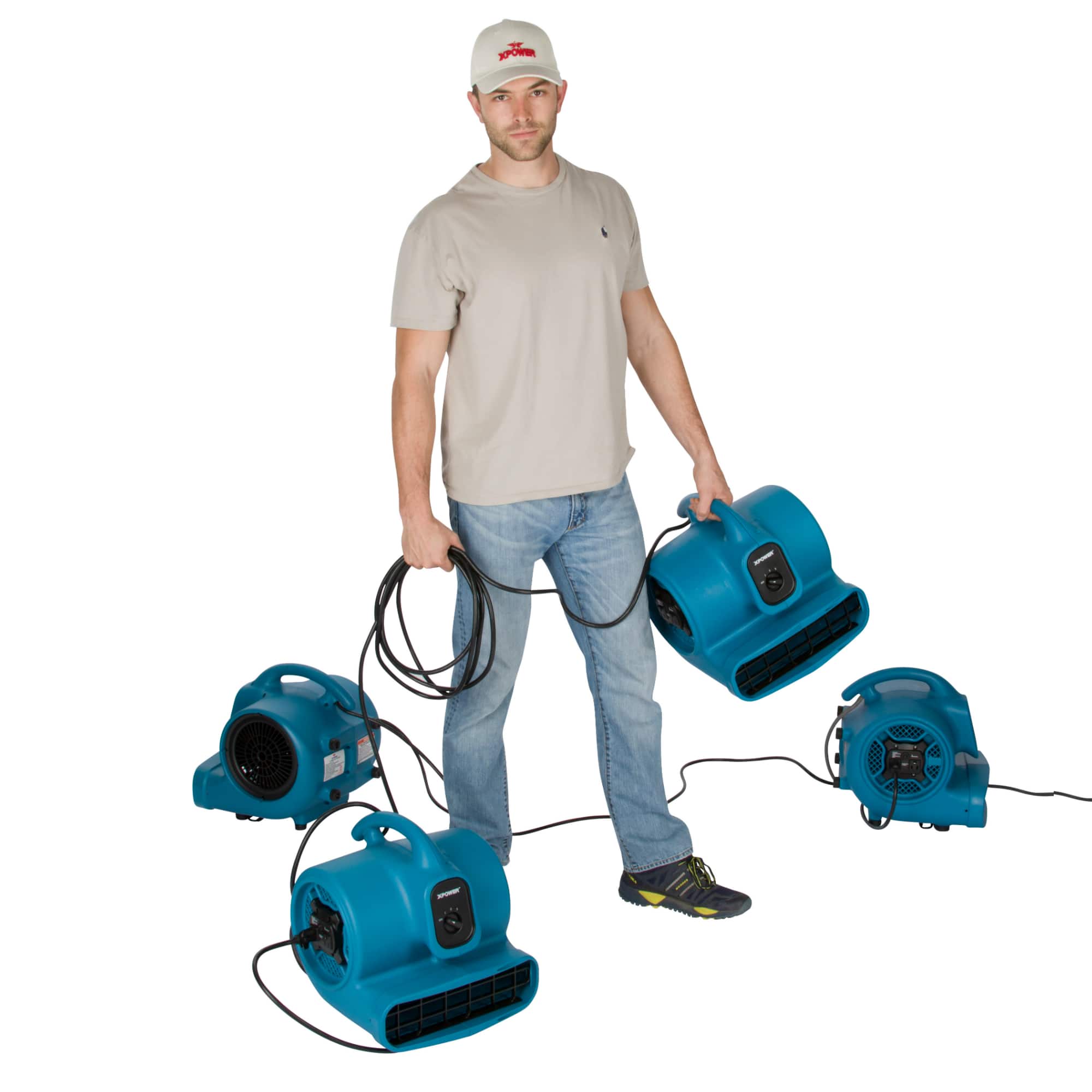 man carrying a blue xpower x 400a and 3 other units are daisy chained on the floor around him